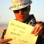 Burner is answering, "wdydwyd?" (aka "why do you do what you do?") on the playa in 2008. Image by Tony Deifell via Flickr. Used under Creative Commons license.