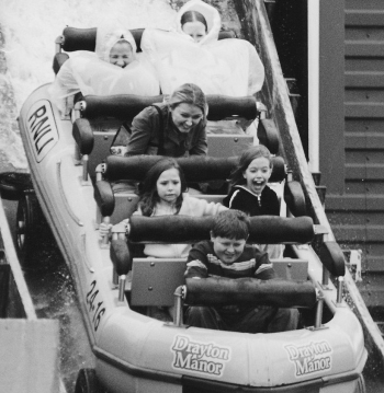 children on a water ride demonstrate different reactions to fear